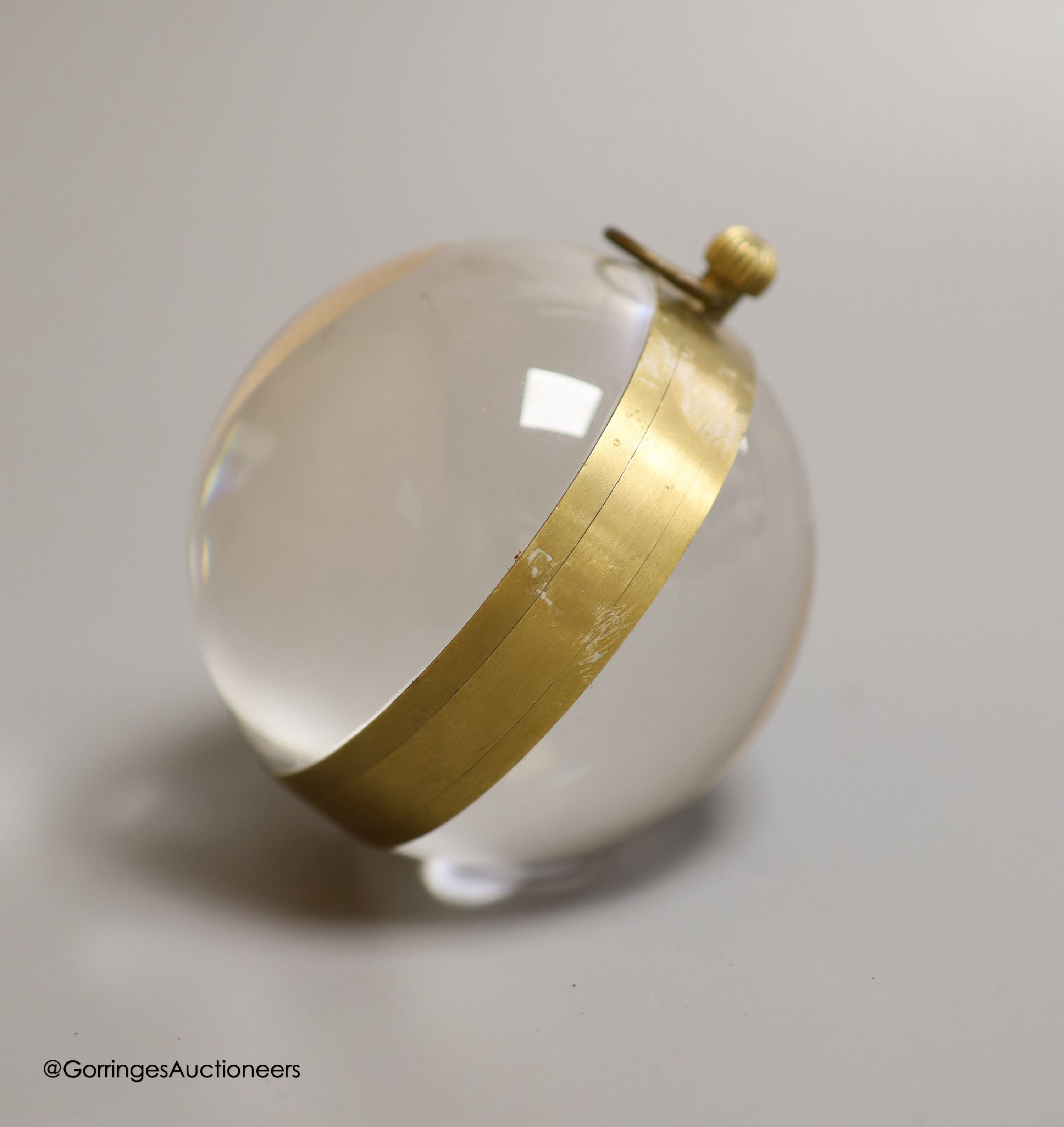 A spherical glass bullseye timepiece